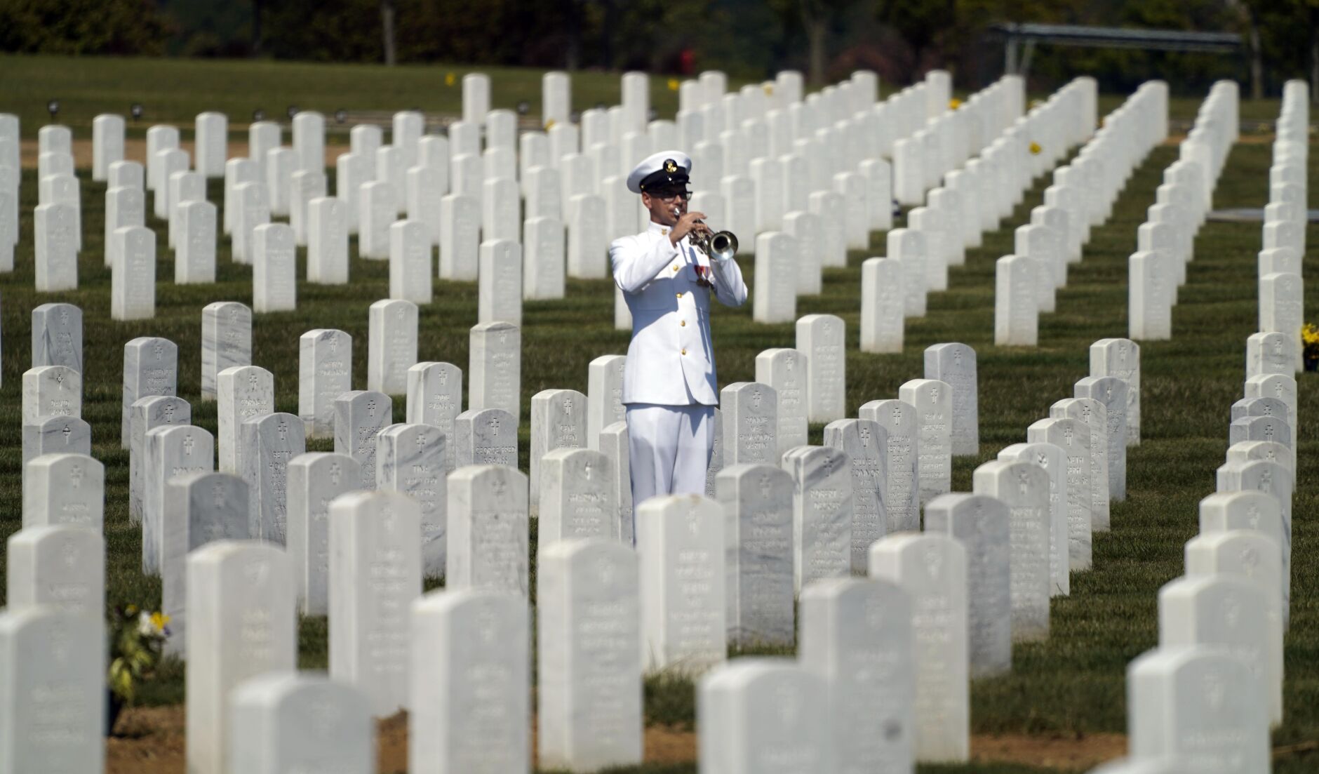 A Navy trumpeter plays Taps
